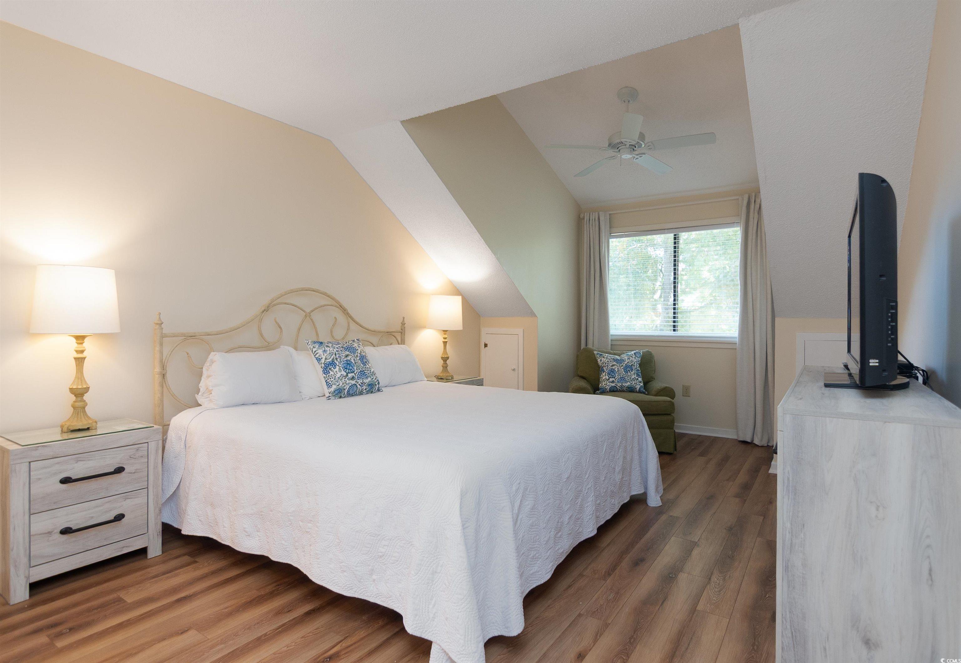 175 St Clears Way, Unit 23I Myrtle Beach, SC 29572 - Photo 13 of 39 Bedroom featuring wood finished floors, a ceiling fan, and lofted ceiling