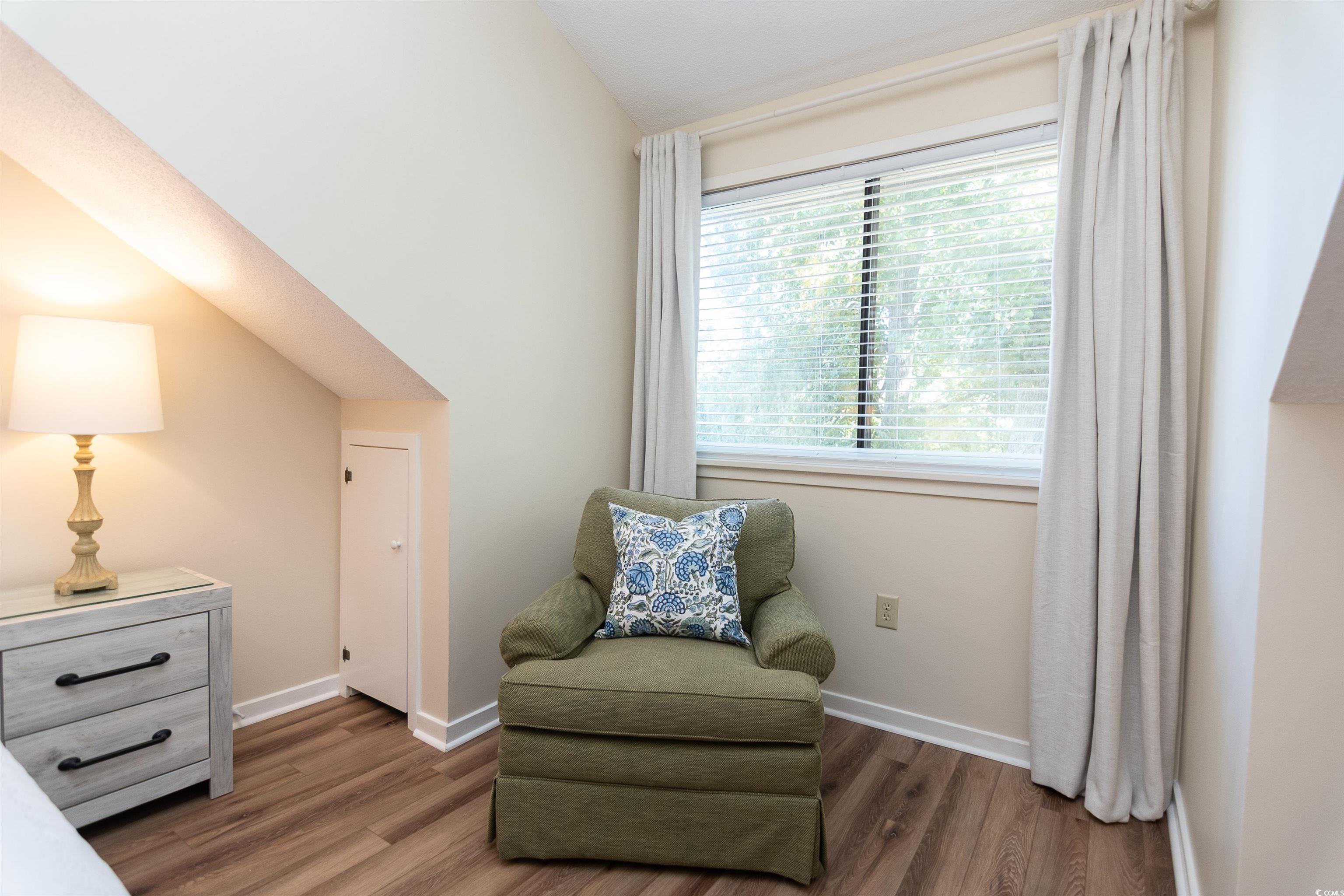 175 St Clears Way, Unit 23I Myrtle Beach, SC 29572 - Photo 16 of 39 Living area with wood finished floors and baseboards