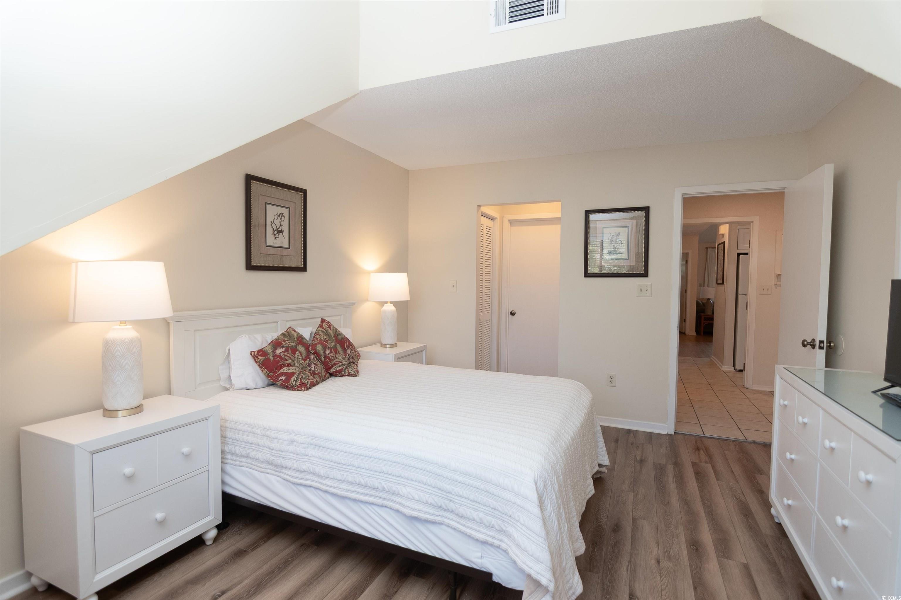 175 St Clears Way, Unit 23I Myrtle Beach, SC 29572 - Photo 22 of 39 Bedroom with light wood finished floors and a closet