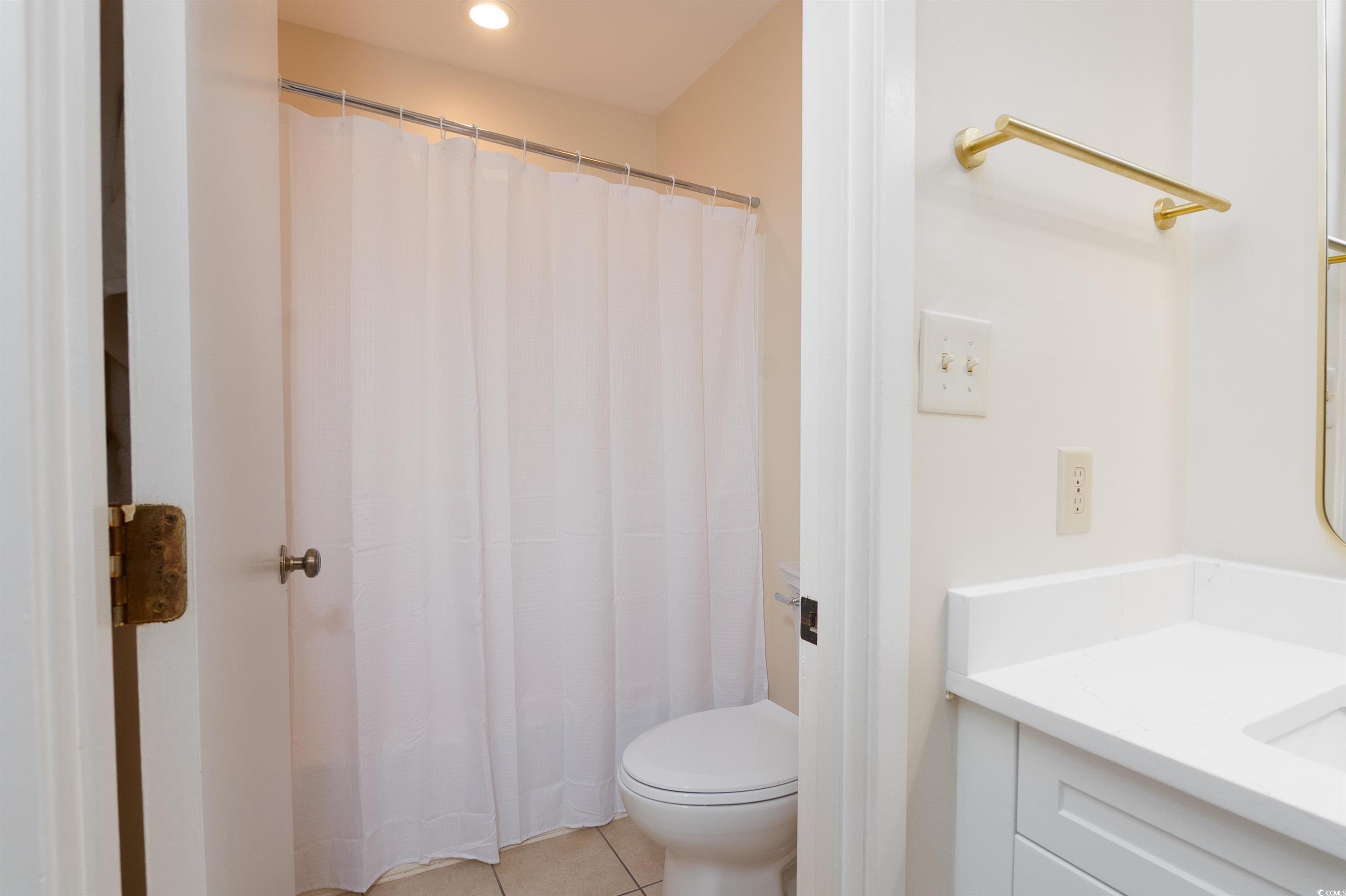 175 St Clears Way, Unit 23I Myrtle Beach, SC 29572 - Photo 30 of 39 Full bathroom featuring light tile patterned flooring, vanity, a shower with curtain, and recessed lighting