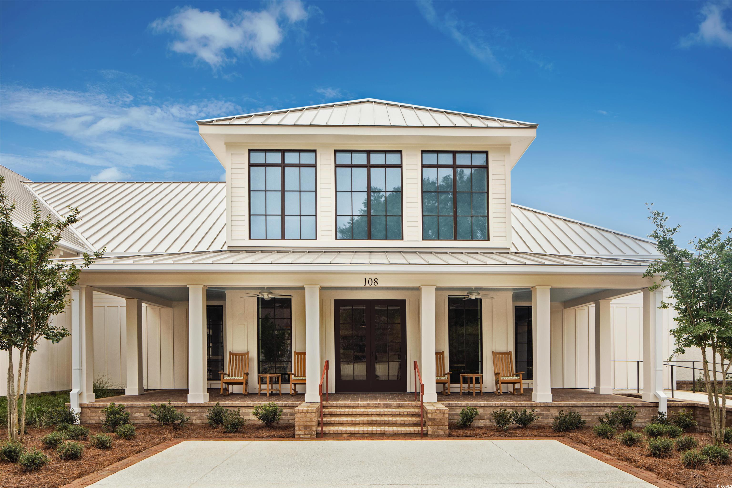 175 St Clears Way, Unit 23I Myrtle Beach, SC 29572 - Photo 37 of 39 View of front of property with a standing seam roof, a metal roof, board and batten siding, covered porch, and french doors