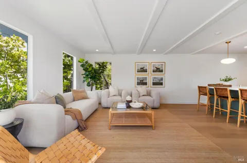 a living room with furniture and windows