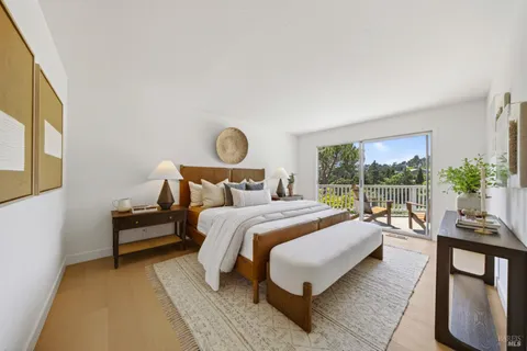 a bedroom with a bed and large window