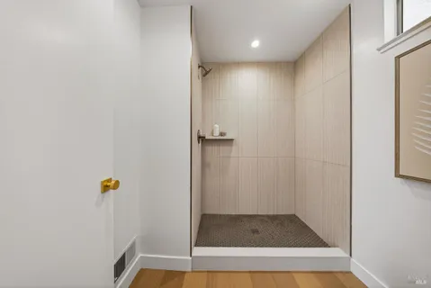 a view of hallway with shower