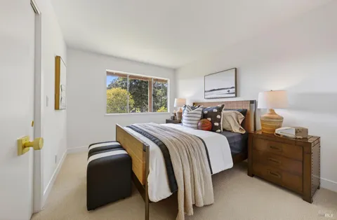 a bedroom with a bed and dresser