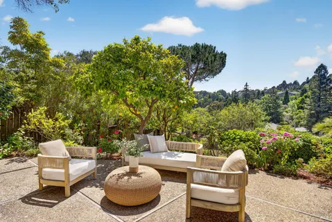 a outdoor living space with furniture and city view
