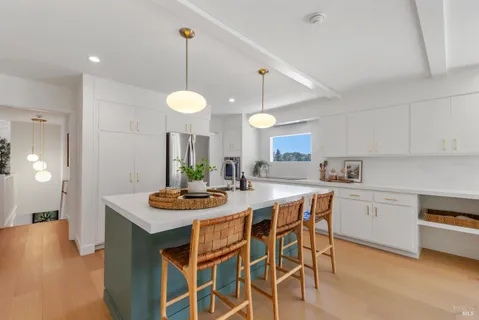 a kitchen with a table and chairs in it