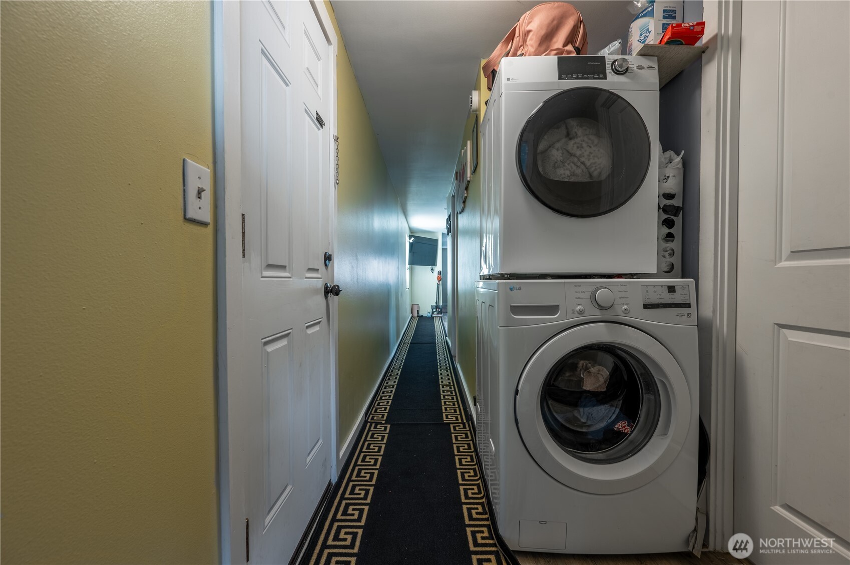 24415 64th Avenue South, Unit 2 Kent, WA 98032 - Photo 19 of 23 a view of a hallway with washer and dryer