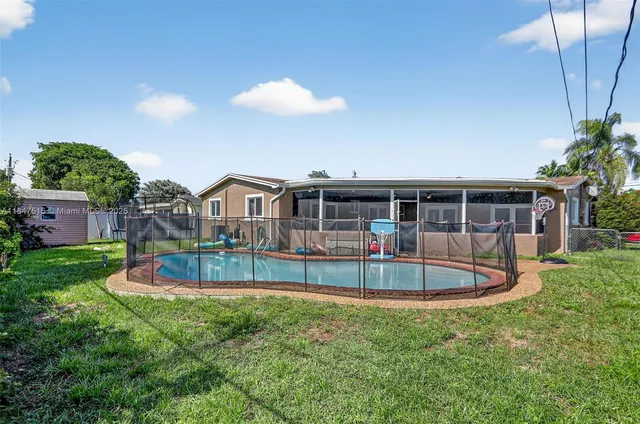 a view of a house with a swimming pool