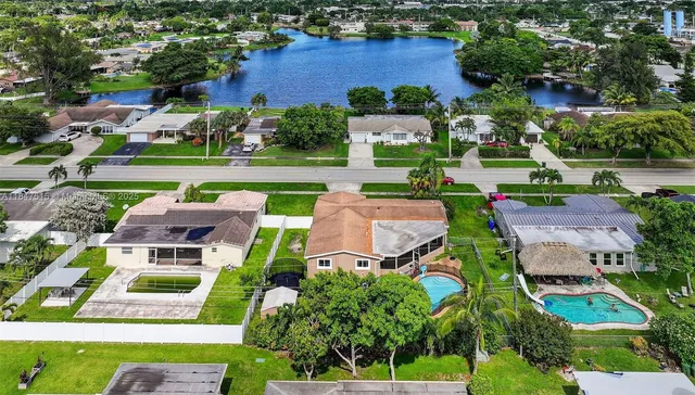 an aerial view of a house with a garden