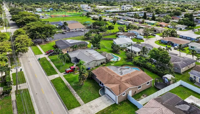 an aerial view of a house with a garden