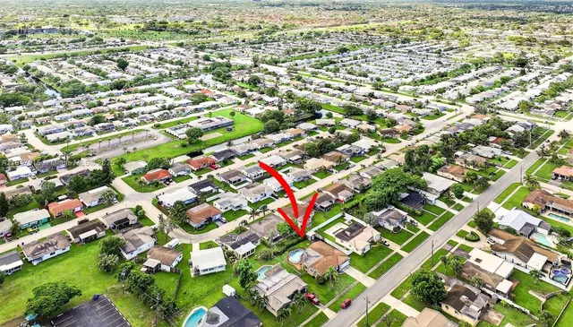 a view of a swimming pool with a backyard