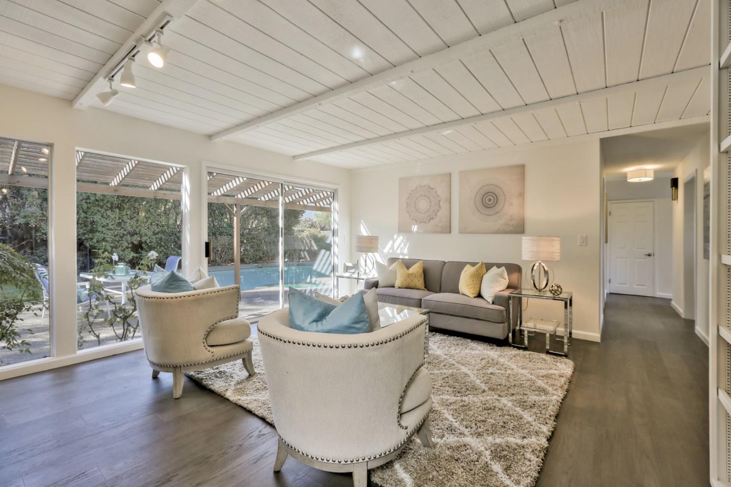 970 Covington Road Los Altos, CA 94024 - Photo 24 of 47 a living room with furniture and a potted plant
