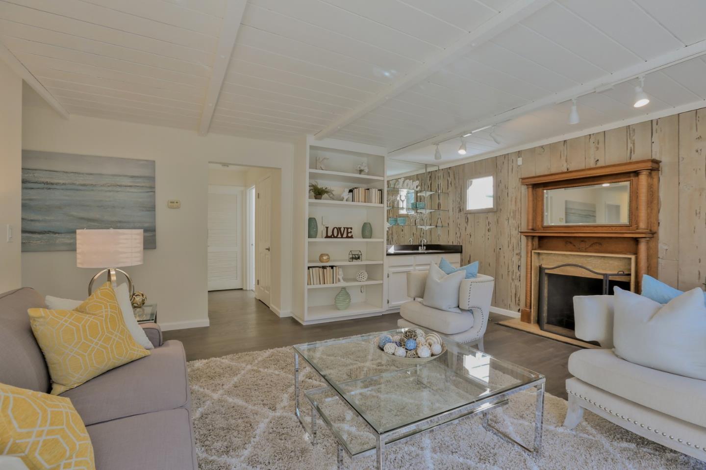 970 Covington Road Los Altos, CA 94024 - Photo 26 of 47 a living room with furniture a fireplace and a flat screen tv
