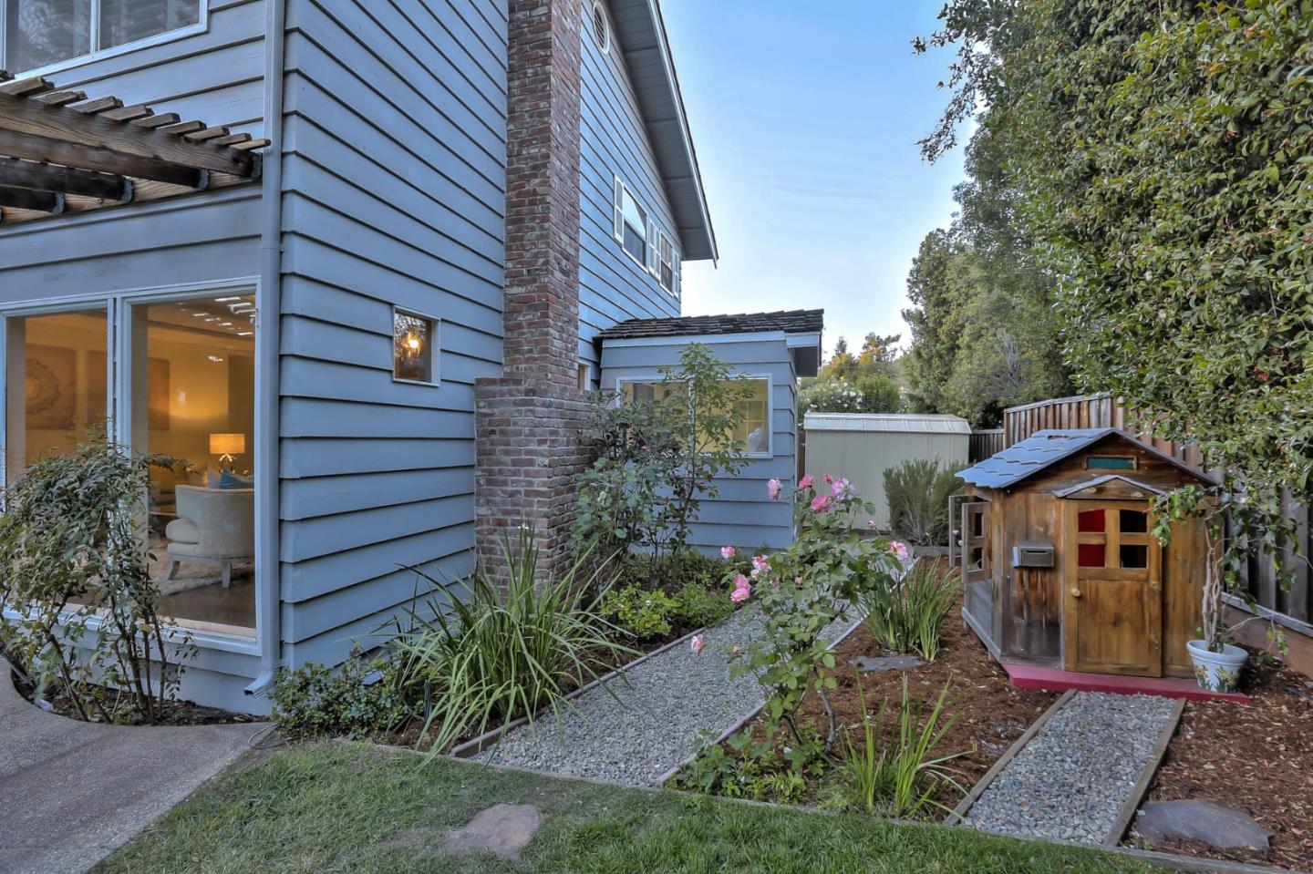 970 Covington Road Los Altos, CA 94024 - Photo 39 of 47 a front view of a house with a garden