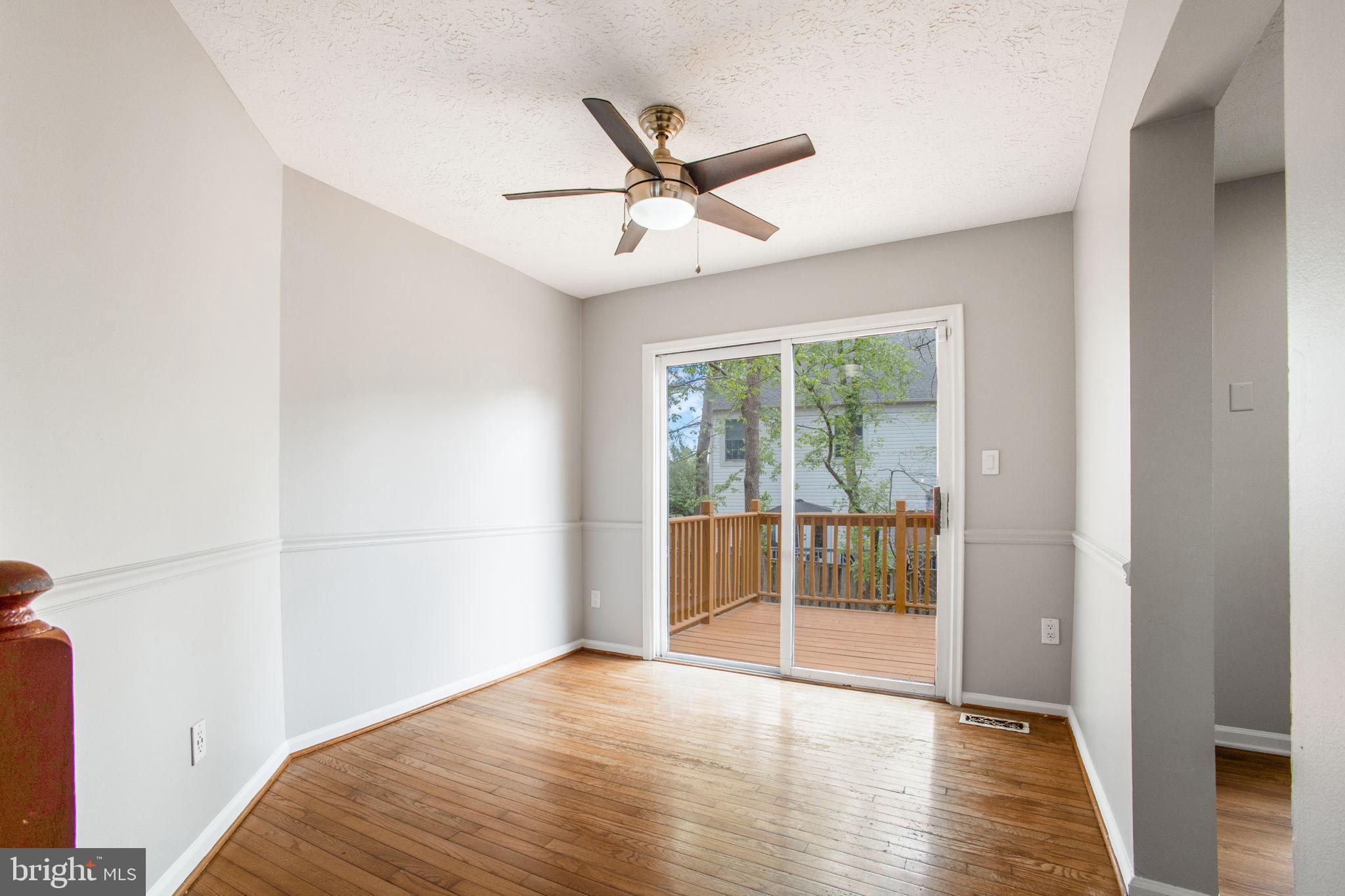 2102 Commissary Circle Odenton, MD 21113 - Photo 13 of 54 a view of a livingroom with a ceiling fan and window
