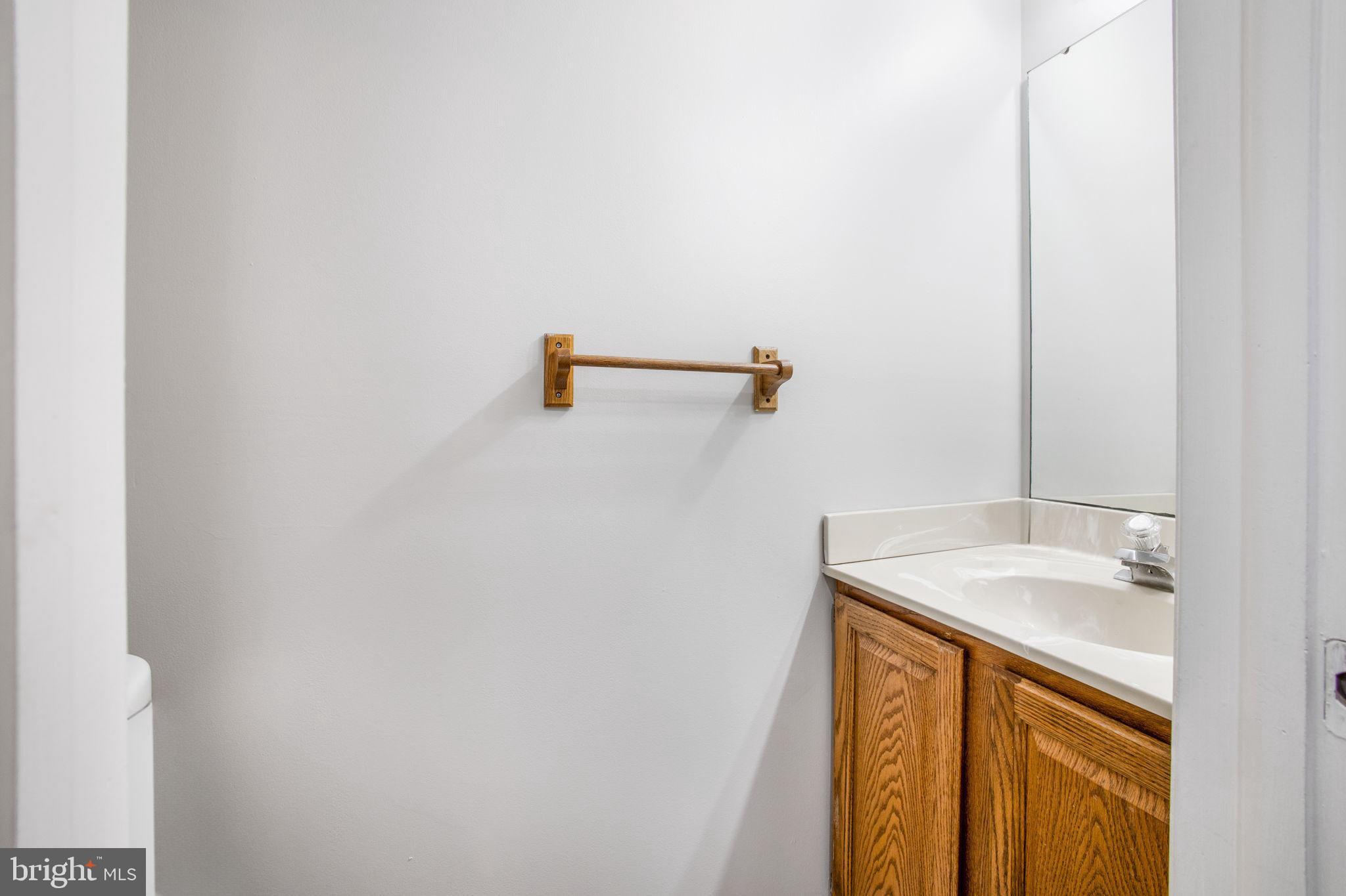 2102 Commissary Circle Odenton, MD 21113 - Photo 22 of 54 a bathroom with a sink and mirror