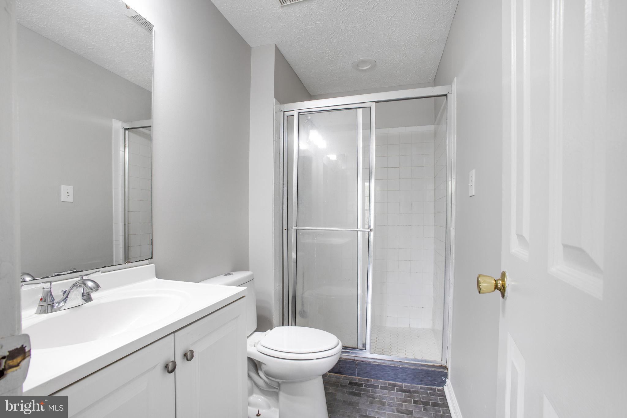 2102 Commissary Circle Odenton, MD 21113 - Photo 24 of 54 a bathroom with a sink and a toilet