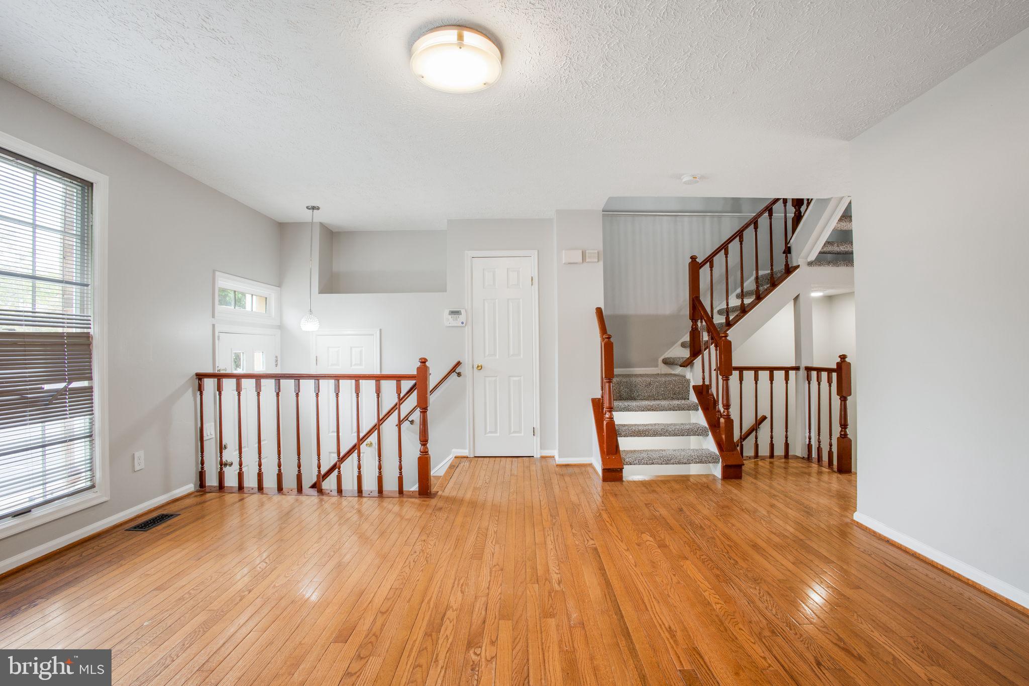 2102 Commissary Circle Odenton, MD 21113 - Photo 6 of 54 a view of entryway with wooden floor