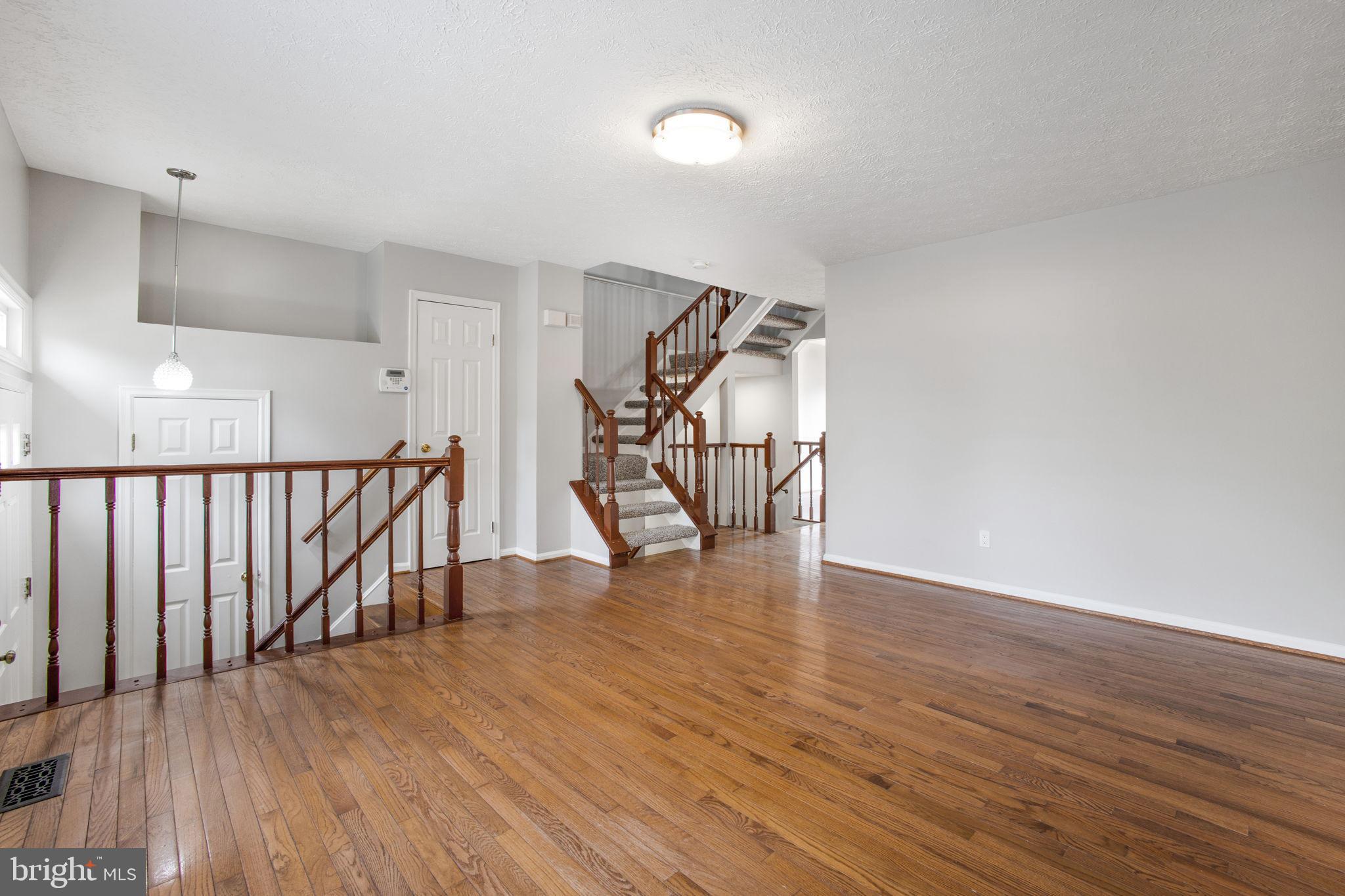 2102 Commissary Circle Odenton, MD 21113 - Photo 7 of 54 a view of an entryway with wooden floor