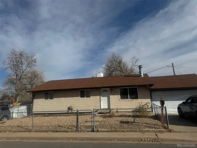 a front view of a house with garage