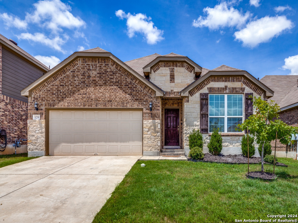 129 Aberdeen Boerne, TX 78015 - Photo 1 of 12 a front view of a house with garden