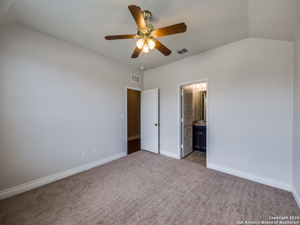 129 Aberdeen Boerne, TX 78015 - Photo 5 of 12 an empty room with closet and a ceiling fan