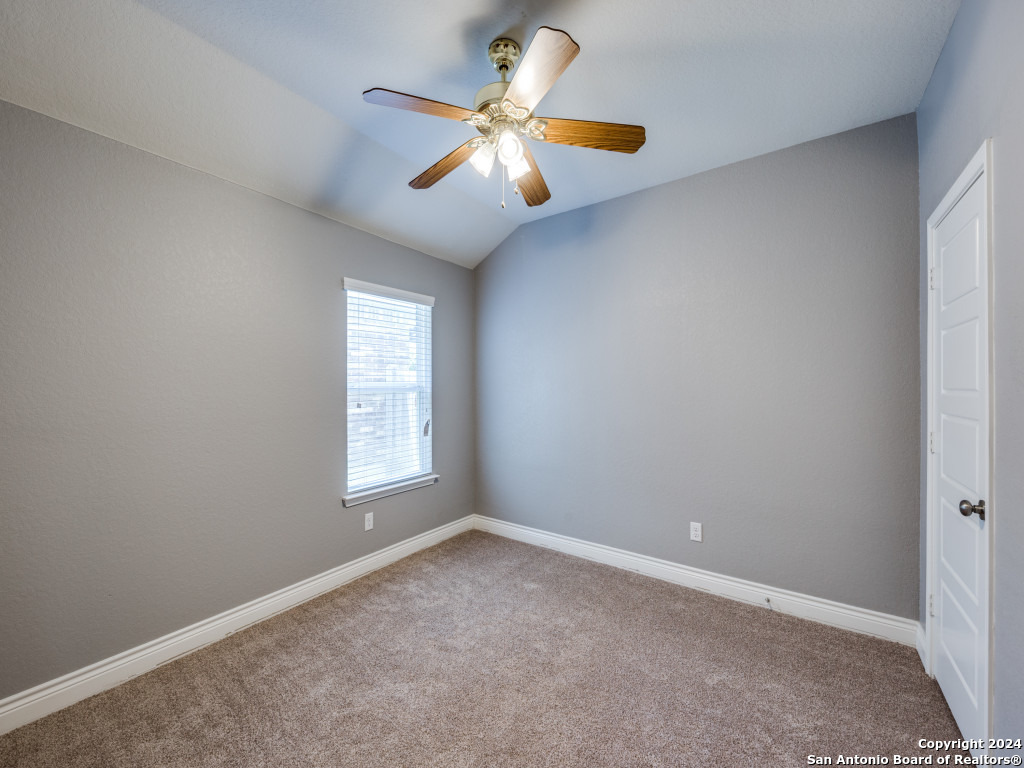 129 Aberdeen Boerne, TX 78015 - Photo 6 of 12 an empty room with a window and a fan