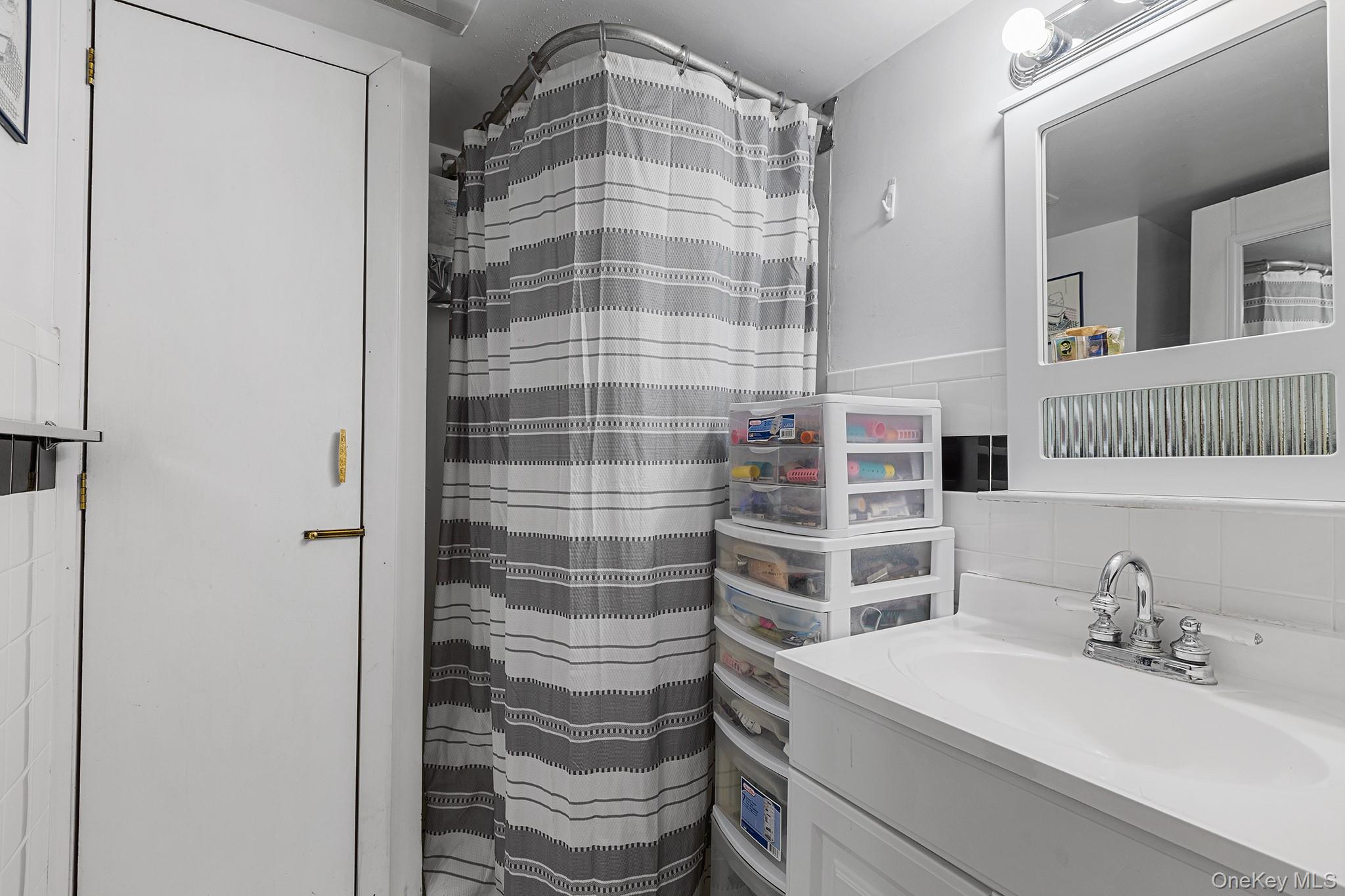 11 Hustis Road Cold Spring, NY 10516 - Photo 11 of 19 a bathroom with a sink and a mirror
