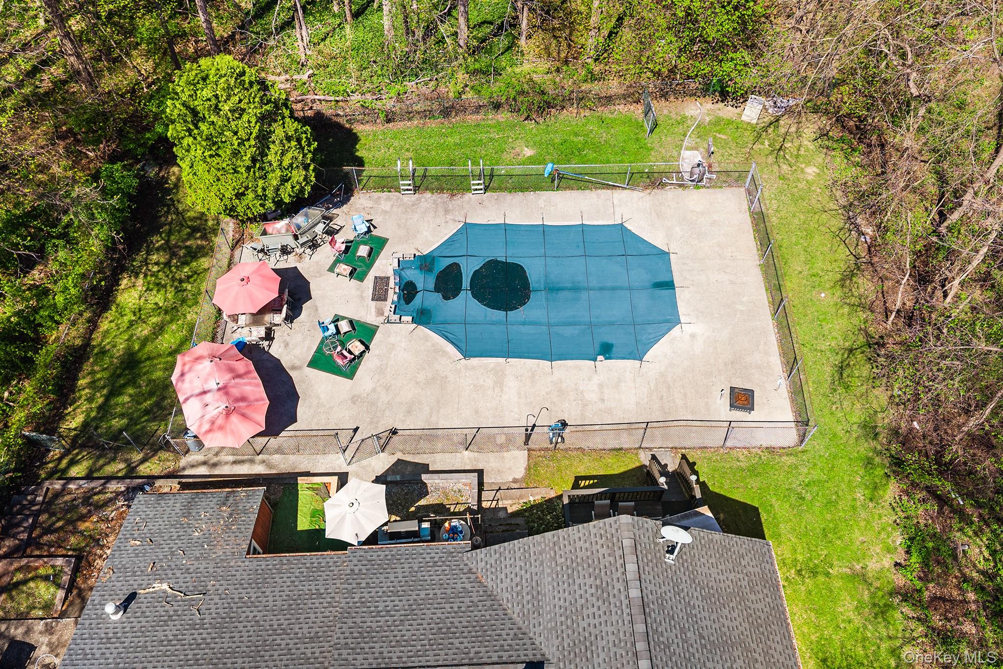 11 Hustis Road Cold Spring, NY 10516 - Photo 16 of 19 an aerial view of a house with swimming pool and large trees