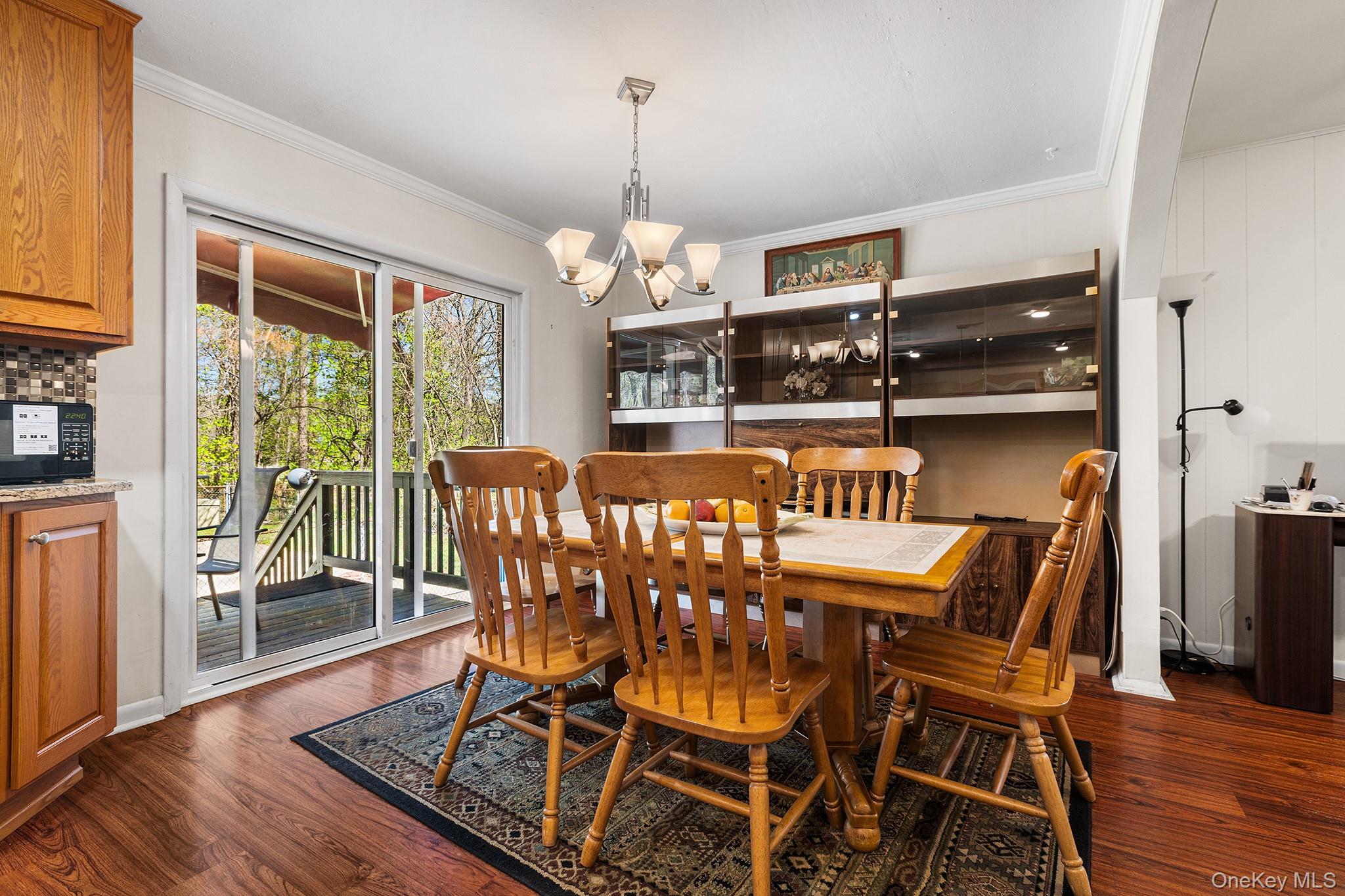 11 Hustis Road Cold Spring, NY 10516 - Photo 7 of 19 a view of a dining room with furniture wooden floor and chandelier