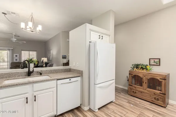 a view of a kitchen with washer and dryer