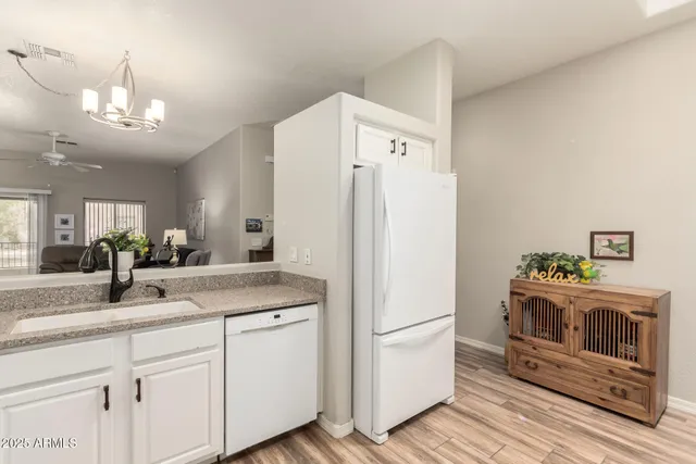 a view of a kitchen with washer and dryer