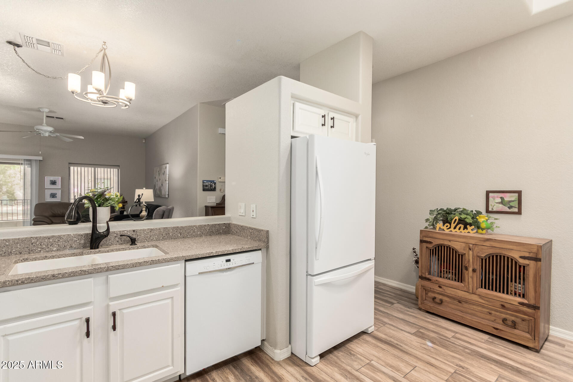 2368 West 10th Avenue Apache Junction, AZ 85120 - Photo 12 of 30 a kitchen with cabinets and stainless steel appliances