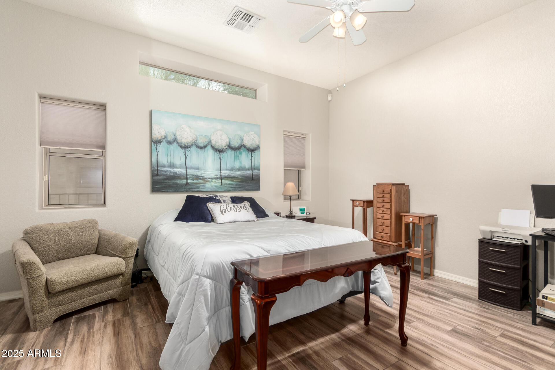 2368 West 10th Avenue Apache Junction, AZ 85120 - Photo 13 of 30 a bedroom with a bed and a couch