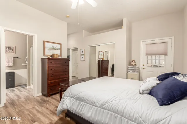 a bedroom with a bed and a couch