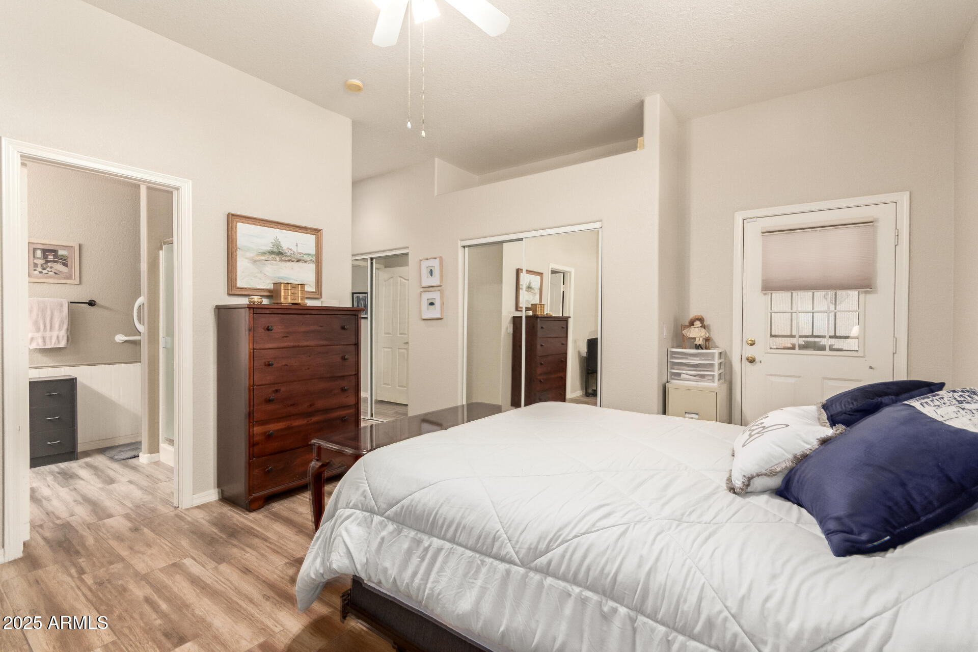 2368 West 10th Avenue Apache Junction, AZ 85120 - Photo 14 of 30 a bedroom with a bed and a closet