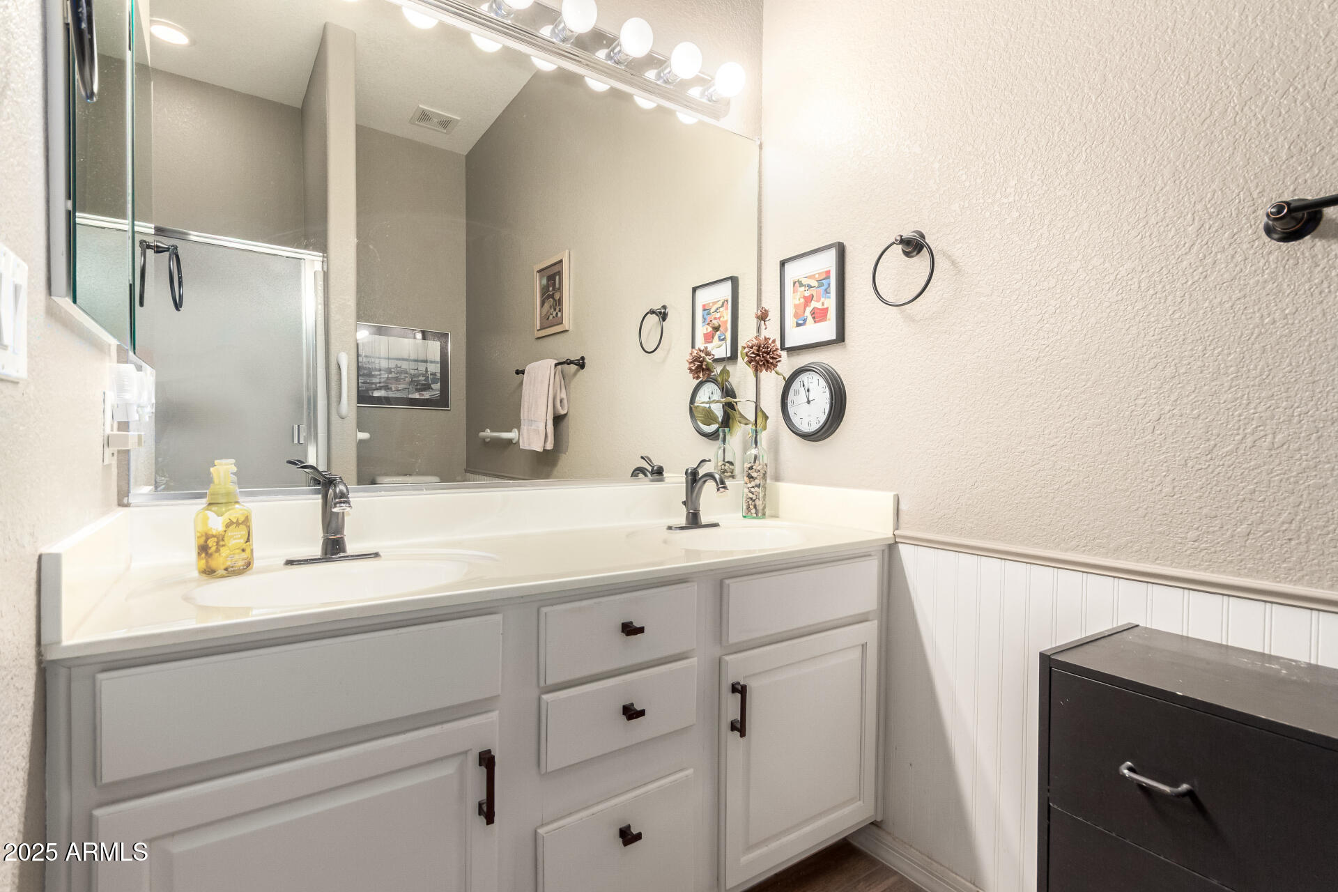 2368 West 10th Avenue Apache Junction, AZ 85120 - Photo 15 of 30 a bathroom with a sink and a mirror