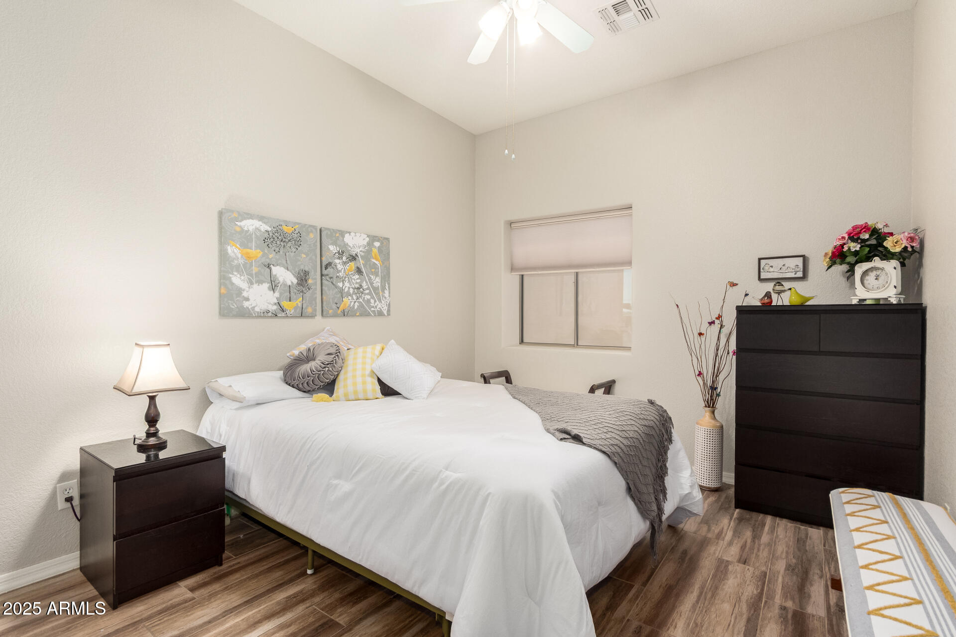 2368 West 10th Avenue Apache Junction, AZ 85120 - Photo 17 of 30 a bedroom with a bed and cabinet