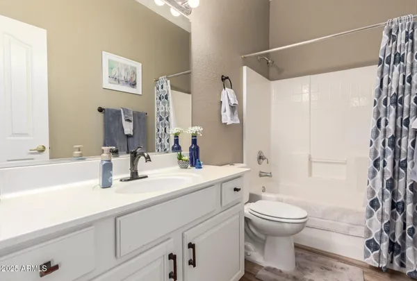 a bedroom with a bed and cabinet