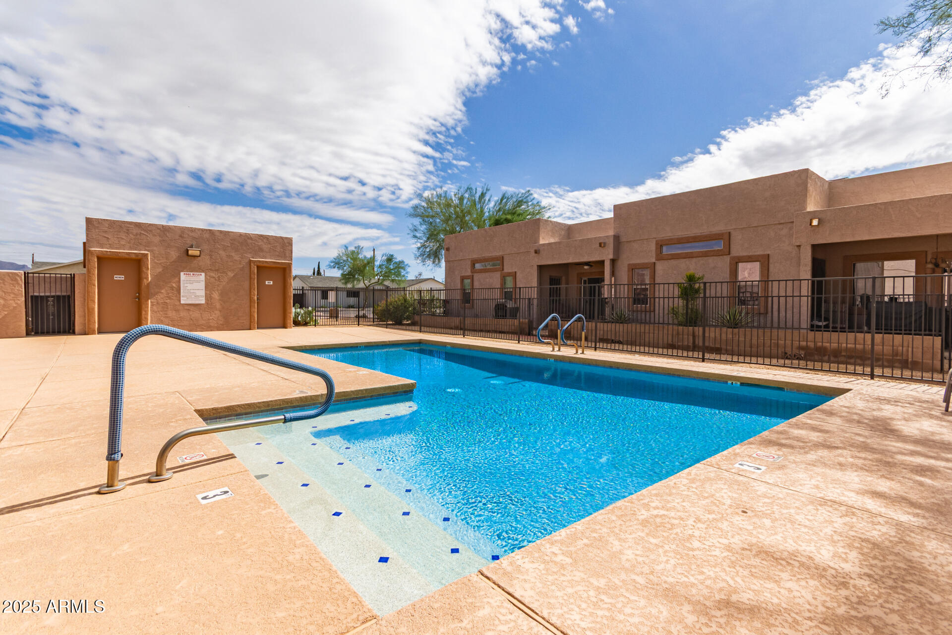 2368 West 10th Avenue Apache Junction, AZ 85120 - Photo 26 of 30 a swimming pool with outdoor seating and yard