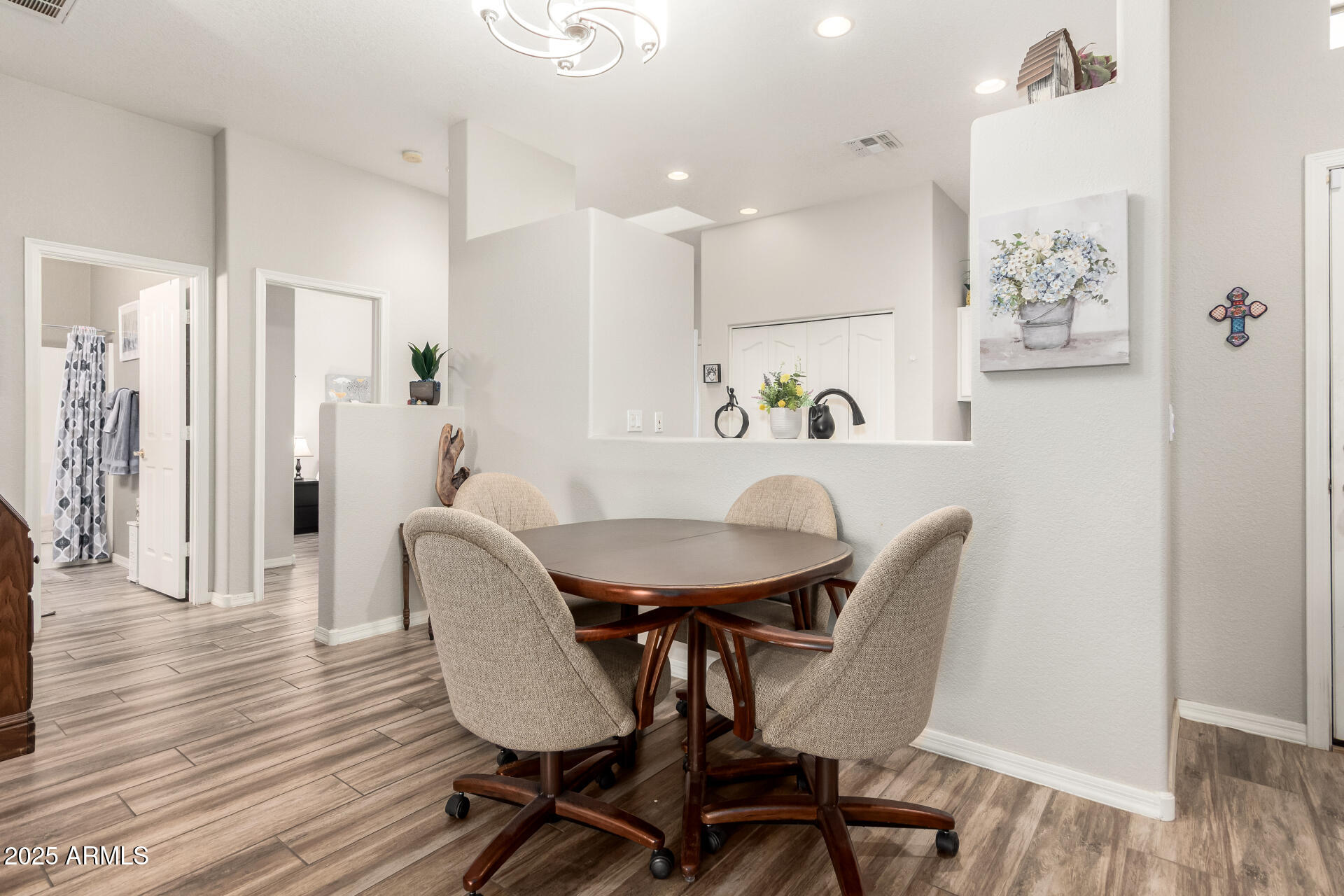 2368 West 10th Avenue Apache Junction, AZ 85120 - Photo 8 of 30 a dining room with furniture and wooden floor