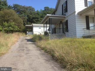 12000 Messick Road Southeast Cumberland, MD 21502 - Photo 2 of 6 Right Front/Side View of Main House and Driveway