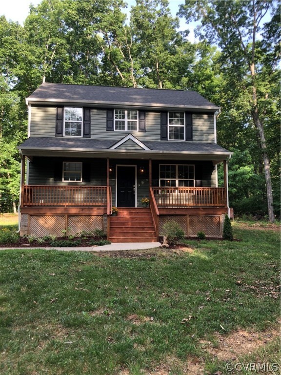 4974 Shannon Road Kents Store, VA 23084 - Photo 1 of 1 a front view of a house with a yard
