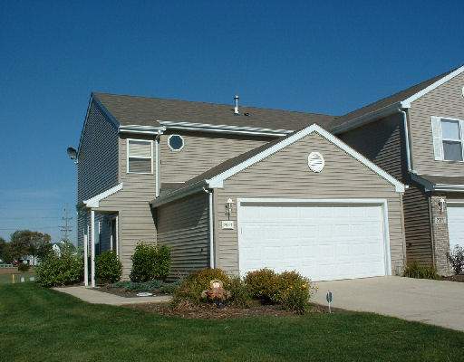 25117 Faraday Road, Unit 2511 Manhattan, IL 60442 - Photo 1 of 1 a front view of house with yard and green space