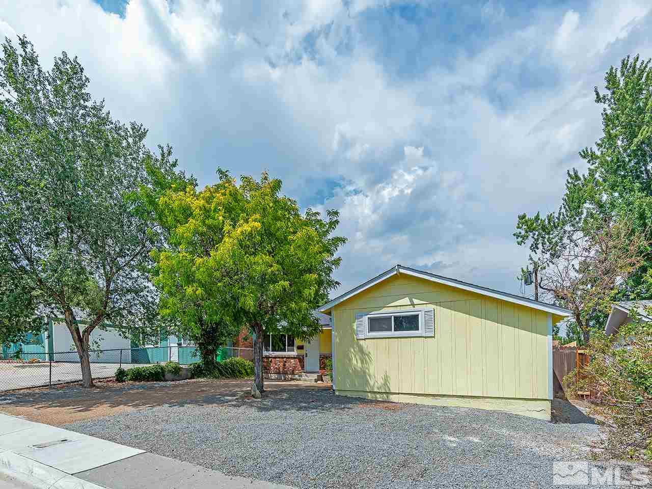 1775 West 6th Street Reno, NV 89503 - Photo 2 of 15 a front view of a house with a yard and garage
