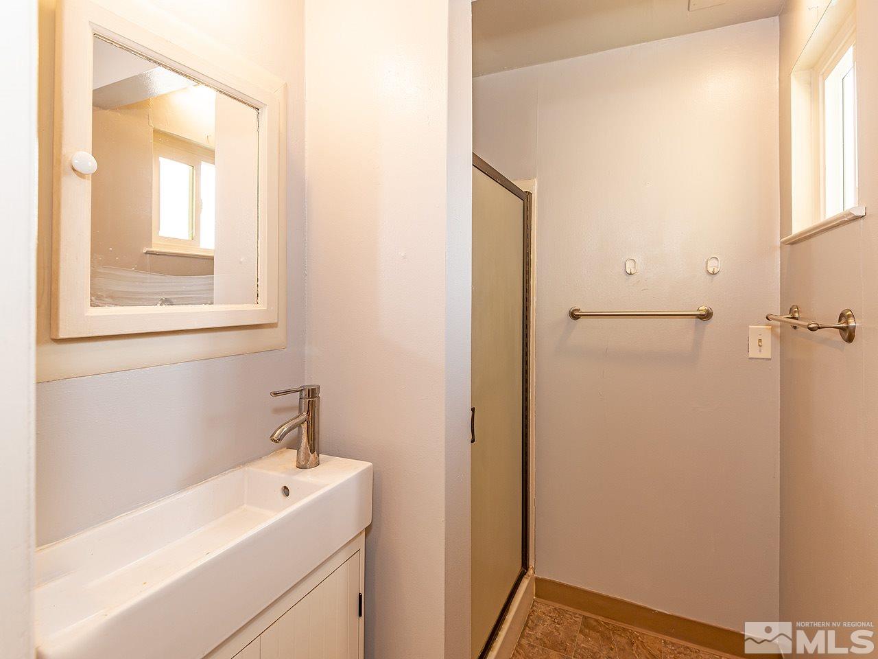 1775 West 6th Street Reno, NV 89503 - Photo 9 of 15 a bathroom with a sink and a mirror