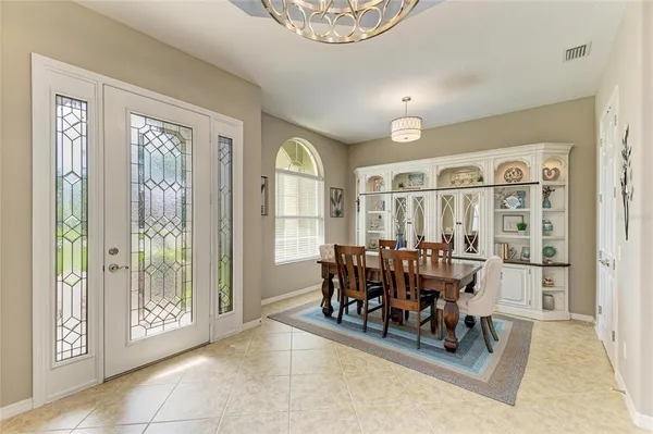a view of a dining room with furniture window and outside view