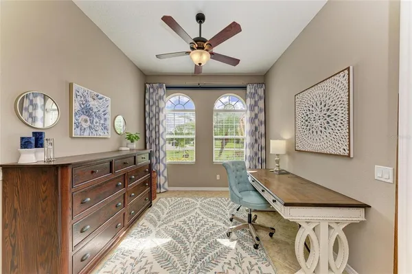 a large kitchen with a table and chairs