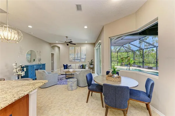 a kitchen with lots of counter top space appliances and cabinets
